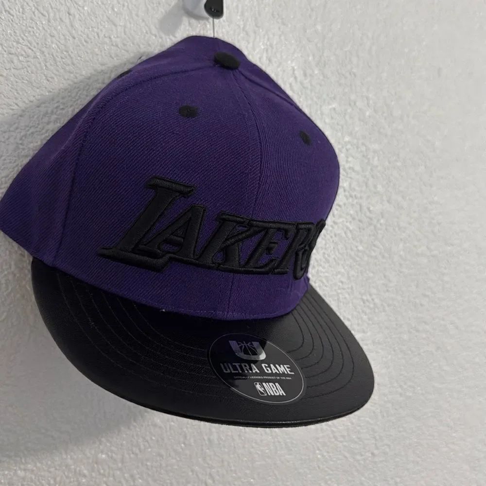 Official NBA- Lakers-purple and black snap back embroidered logo hat